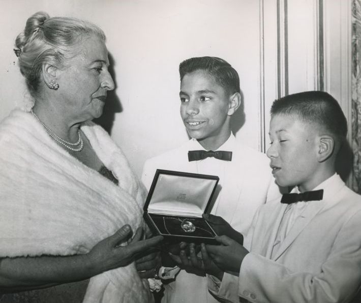 David and Leon Yoder the first two children taken into the Welcome House family in 1949 present a locket of friendship to Pearl buck, May 5, 1960